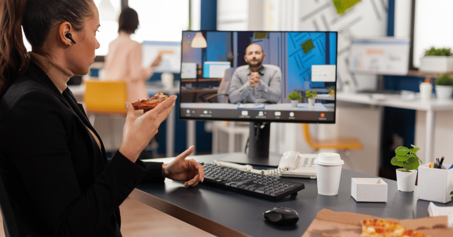 software engineer working remotely for a startup eats pizza on her break