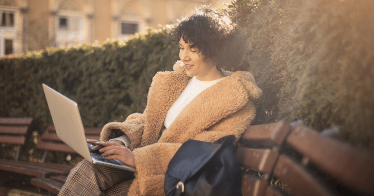 Woman working outside on laptop (1)