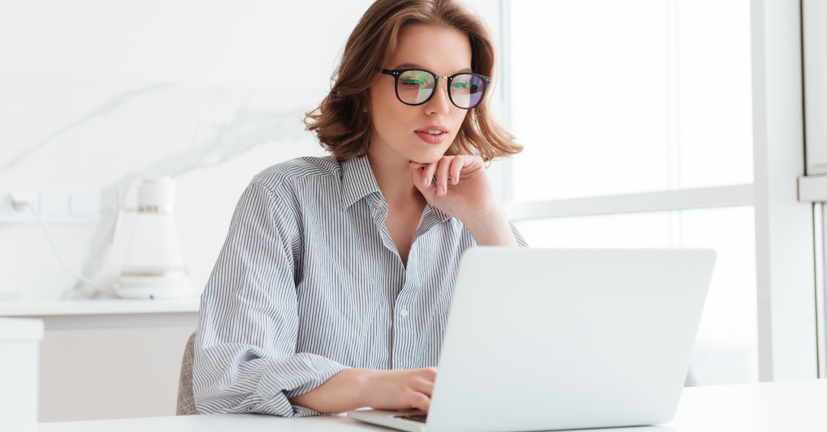 woman-LATAM-Engineer-working-with-laptop-computer-while-siting-home